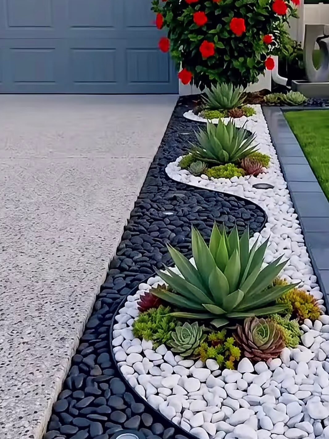 Decorative garden border beside a driveway